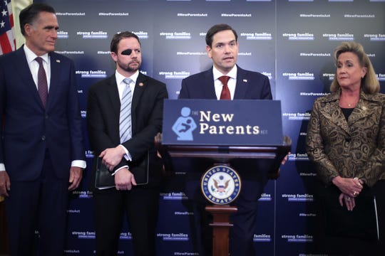 Sen. Mitt Romney, R-Utah, Rep. Dan Crenshaw, R-Tx., Sen. Marco Rubio. R-Fla., and Rep. Ann Wagner, R-Mo. introduce their paid family leave legislation during a news conference in the Russell Senate Office Building on Capitol Hill March 27, 2019 in Washington, D.C. Based on a legislative idea Rubio and Wagner proposed last year, the New Parents Act will provide mothers and fathers with pay while caring for a new baby by allowing them to delay drawing their future Social Security benefits.