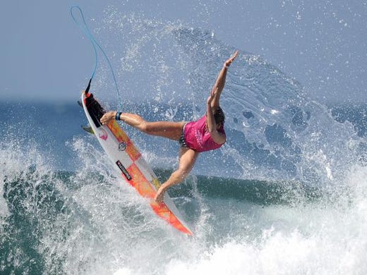 Courtney Conlogue of the US performs a maneuver on a wave one day before the start of the World Surf League women's championship tour surfing event at Keramas in Gianyar on Indonesia's resort island of Bali on May 12, 2019. (