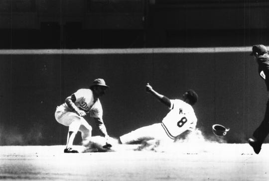 APRIL 7, 1975: Reds' Joe Morgan Steals First Base Of Year...Dodgers' Davey Lopes was too late with tag in first-inning play during Reds' opener Monday. Cincinnati won, 2-1, in 14 innings.