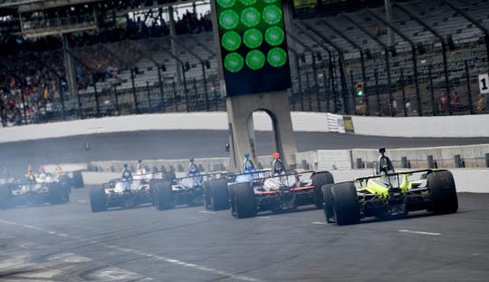 The IndyCars are heading to Pit Road at the beginning of the Carb Day at the Indianapolis Motor Speedway on Friday, May 24, 2019.