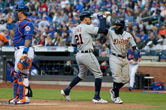 JaCoby Jones celebrates his second race in two sets with Josh Harrison.