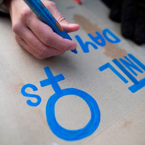 Making a sign at an International Women's Day...