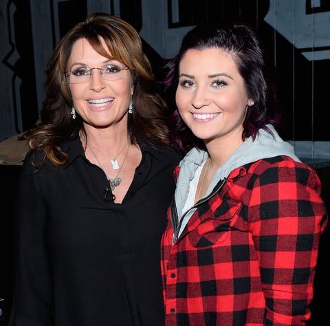 Former Alaska Gov. Sarah Palin, left, and her...