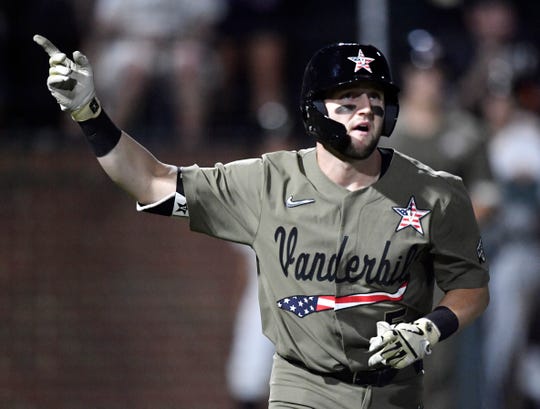 Vanderbilt named hitter Philip Clarke (5) points to the sky after hitting a home run late in the fourth round against Indiana State in the NCAA Division I finals at Hawkins Field on Sunday, June 2 2019 in Nashville, Tennessee. 