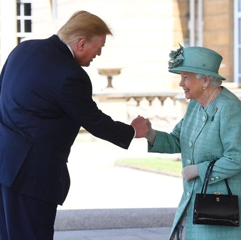 President Donald Trump is greeted by Queen...