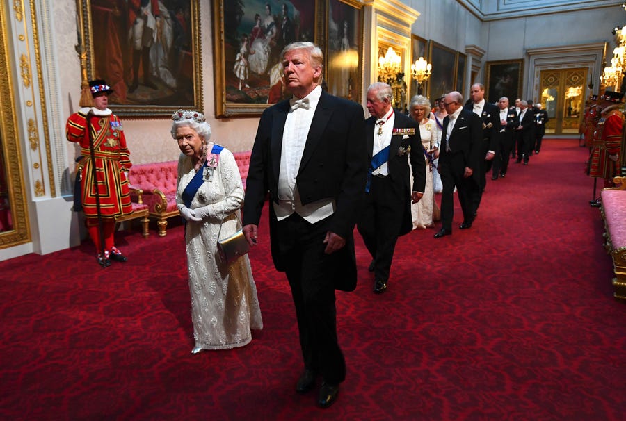 Queen Elizabeth II and President Donald Trump arrive through the East Gallery before a state banquet at Buckingham Palace on June 3.