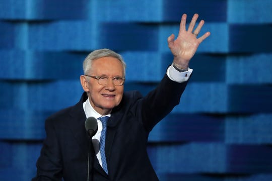 Then-Sen. Minority Leader Harry Reid, D-Nevada, waves to the crowd on the third day of the Democratic National Convention at the Wells Fargo Center on July 27, 2016 in Philadelphia, Pennsylvania.