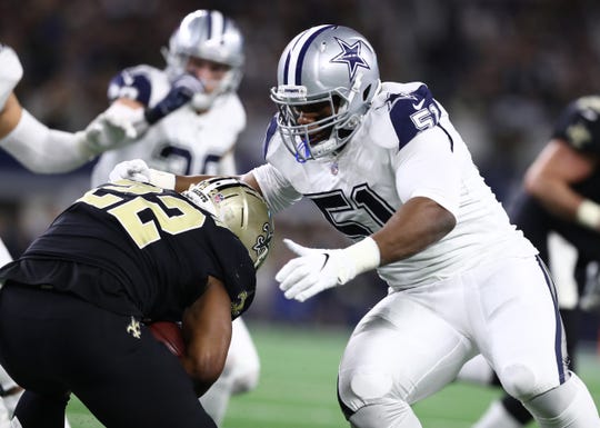 Nov 29, 2018; Arlington, TX, USA; New Orleans Saints running back Mark Ingram (22) runs with the ball against Dallas Cowboys defensive tackle Caraun Reid (51) at AT&T Stadium.