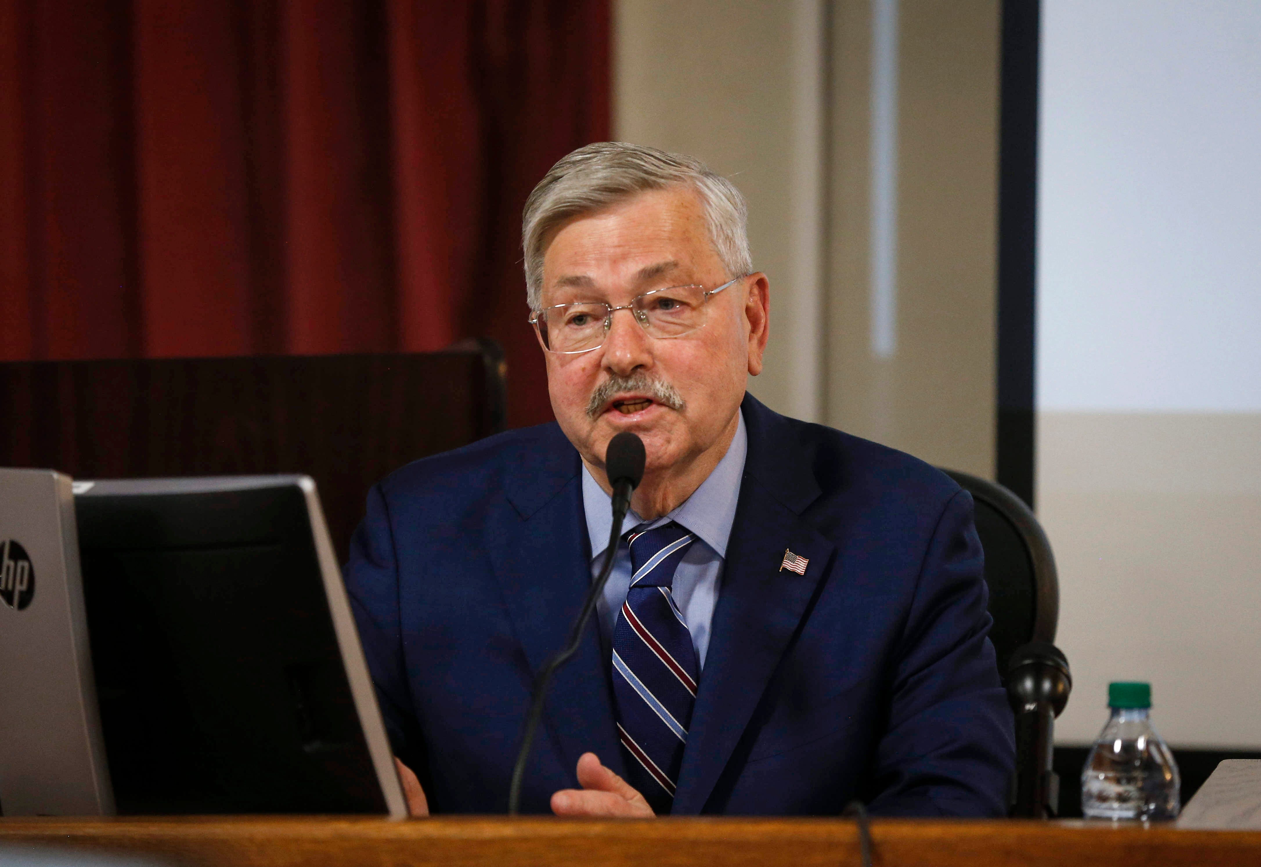 Terry Branstad claims no discrimination in cutting gay official's pay