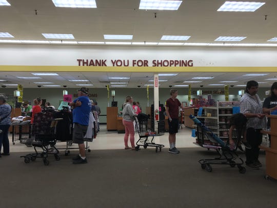 A "thank you for shopping" sign hangs above shoppers June 23 at Shopko in Wisconsin Rapids.