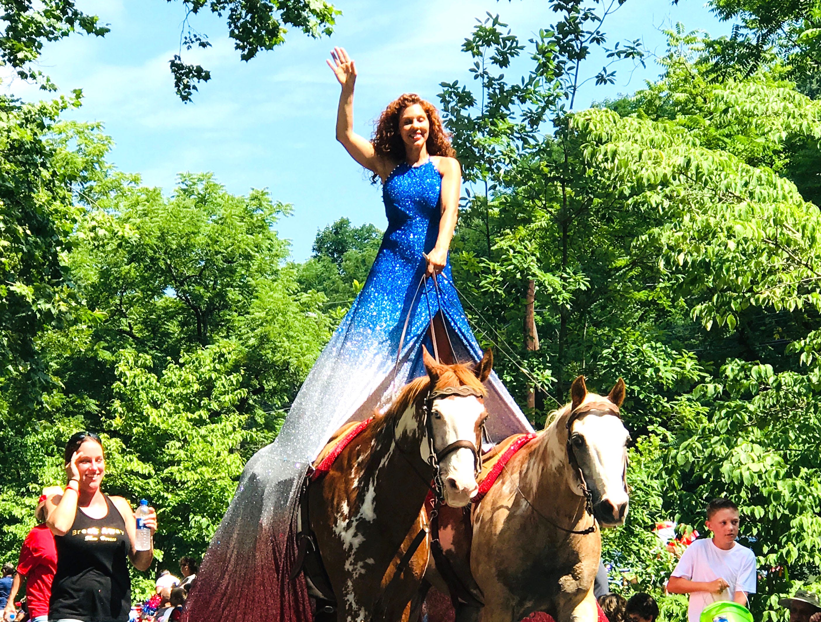 Fairland Ferguson rides her horses in the Happy Birthday America parade