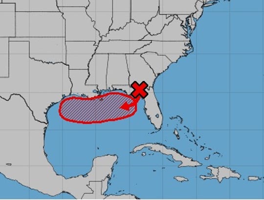 The National Hurricane Center said that there was a 80% chance that a tropical depression will form in the Gulf of Mexico by the end of the week. The red X indicates where the nascent storm is now; the shaded area in red indicates where it could form.