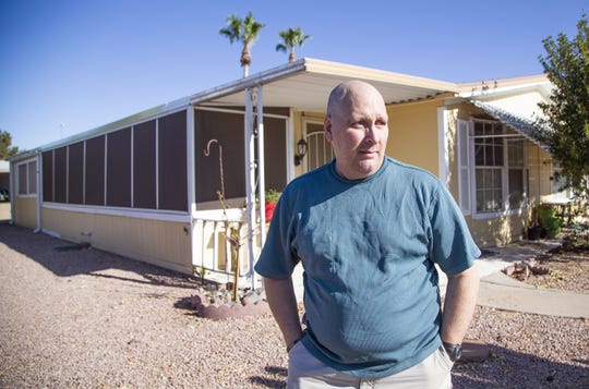 Jim Boerner, a U.S. Air Force veteran, may lose his Mesa home over $236 in unpaid taxes he thought had been paid. He poses outside his home on July 8, 2019.