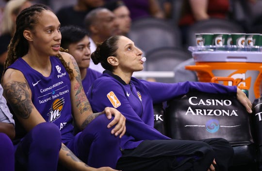 Phoenix Mercury guard Diana Taurasi watches the action from the bench with a back injury against the Dallas Wings in the first half at Talking Stick Resort Arena on July 17, 2019 in Phoenix, Ariz.