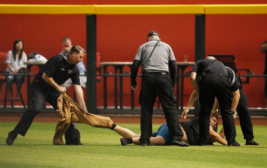 Does baseball have a series problem with fans running onto the field? It appears that way.