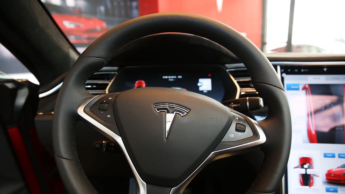 The inside of a Tesla vehicle is viewed as it sits parked in a new Tesla showroom and service center in Red Hook, Brooklyn on July 5, 2016 in New York City. The electric car company and its CEO and founder Elon Musk have come under increasing scrutiny following a crash of one of its electric cars while using the controversial autopilot service. Joshua Brown crashed and died in Florida on May 7 in a Tesla car that was operating on autopilot, which means that Brown's   hands were not on the steering wheel.  