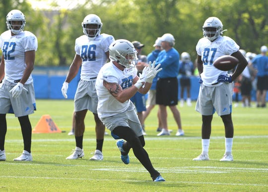 Lions tight end Isaac Nauta readies for a reception during drills.