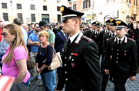 People and Carabinieri arrive to pay their respects in the church where Italian police officer Mario Cerciello Rega lies in state in downtown Rome on July 28, 2019.