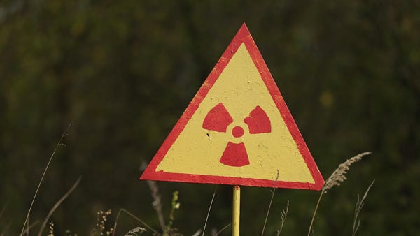 A sign warns of radiation at the site of Kopachi...