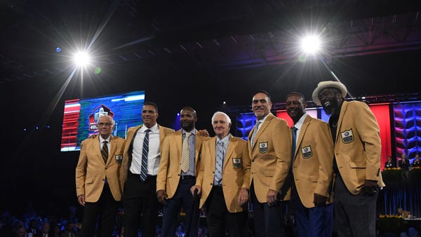 The 2019 Pro Football Hall of Fame inductees pose...