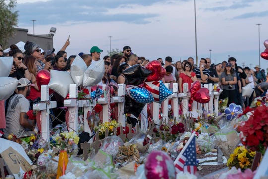 Hundreds of people came to mourn, laying flowers and candles, praying for the victims and their families outside Walmart in El Paso, Texas., on Aug. 6, 2019. The mass shooting Aug. 3, 2019, claimed 22 lives; 25 people were injured.