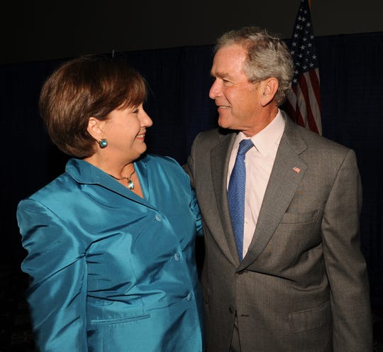 Former Gov. Kathleen Blanco and President George W. Bush visit before the Acadian Ambulance Paramedic Luncheon, May 24, 2011.