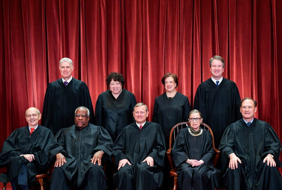 Chief Justice John Roberts sits in the middle for the Supreme Court's official photo, Nov. 30, 2018.