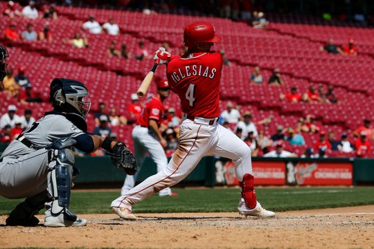 Cincinnati Reds shortstop Jose Iglesias (4) follows through as he grounds out in the eighth inning of the MLB National League game between the Cincinnati Reds and the San Diego Padres at Great American Ball Park in downtown Cincinnati on Wednesday, Aug. 21, 2019. The Reds took the series, 2-1, with a 4-2 win on Wednesday.