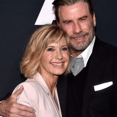 Olivia Newton-John and John Travolta attend the "G