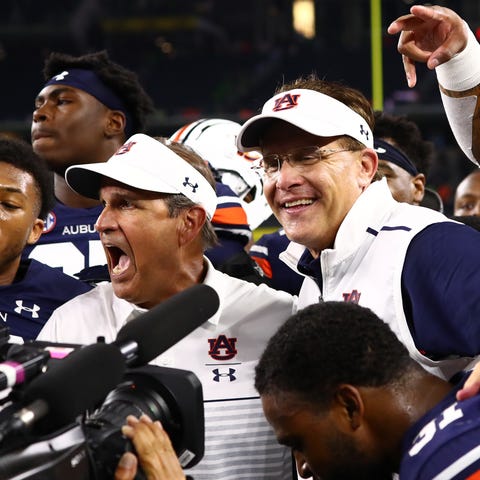 Head coach Gus Malzahn celebrates Auburn's victory