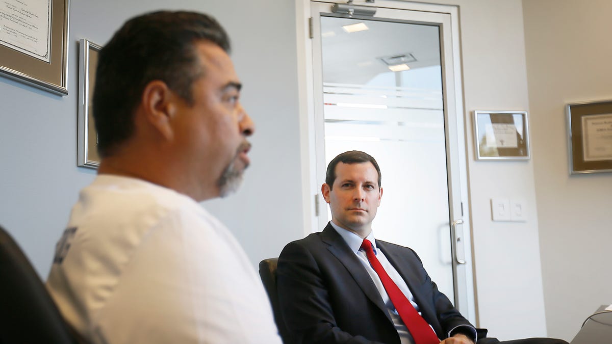 Lawyer Patrick Luff listens to Don Coca, father of Walmart shooting victim Jessica Garcia, talk about the lawsuit filed against Walmart Wednesday, Sept. 4, at James Kennedy PLLC in El Paso. Jessica and Guillermo Garcia, who were both severely injured in the Aug. 3 mass shooting, filed the lawsuit against Walmart Inc. and Wal-Mart Stores Texas LLC. onÊ Aug. 30 in El Paso County district court.