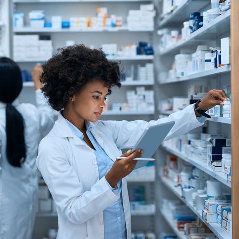 Shot of a young woman doing inventory in a pharmac