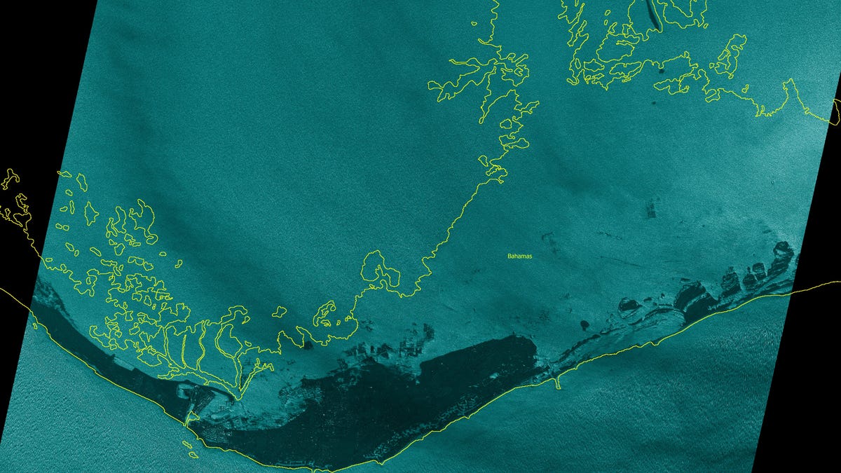 This satellite image taken Monday around noon local time shows vast areas of Grand Bahama Island hit with flooding from Hurricane Dorian.