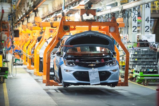 A battery-electric Chevrolet Bolt EV makes its way down the assembly line at General Motors' Lake Orion Assembly assembly plant.