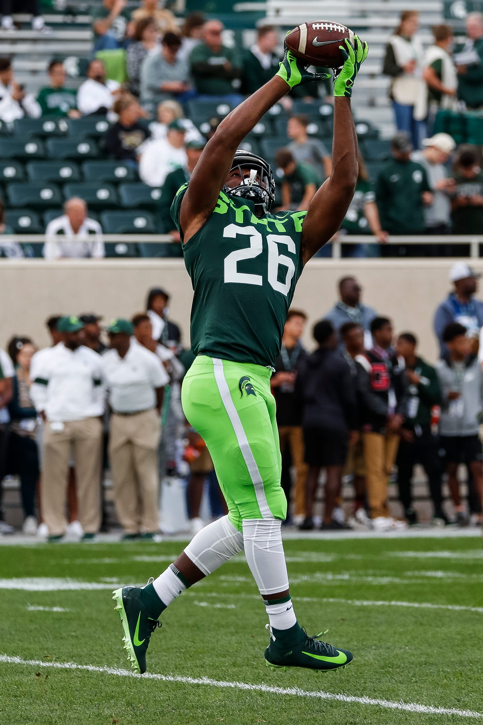 Our best photos of Michigan State football's new neon uniforms