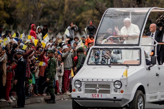 Pope Francis greets crowd as he arrives at the St. Michel complex in Antananarivo in Antananarivo, Madagascar, on September 8, 2019. - Pope Francis visit three-nation tour of Indian Ocean African countries hard hit by poverty, conflict and natural disaster.