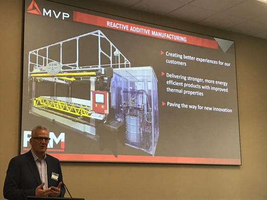 Magnum Venus Products President and CEO Bob Vanderhoff describes the new Reactive Additive Manufacturing 3D printer Sept. 17, 2019.