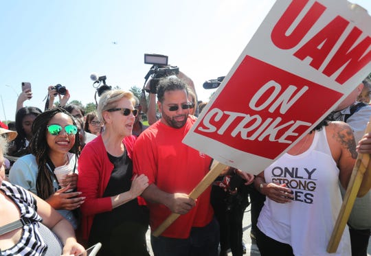 Democratic presidential candidate Elizabeth Warren joins UAW workers on the picket line in front of the Detroit Hamtramck Assembly plant Sunday.