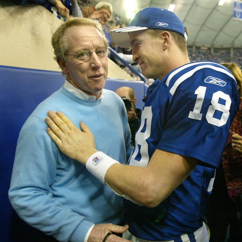 Peyton Manning gets a hug from his father Archie M