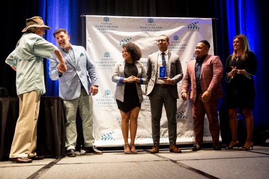 Innovation Star winners from Food Idea Group, Guy Clarke II, Vanessa Fernandez, Melvin Silverio, and Rafael Feliciano accept their award during the Paradise Coast Tourism Star Awards at the Naples Grande Resort in Naples on Friday, September 27, 2019.