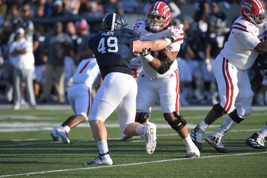 UL offensive lineman Robert Hunt (50, right), a 2020 NFL Draft prospect, blocks during a 2019 game at Georgia Southern.