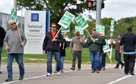 UAW GM and Aramark Local 160 active members and one retiree picket in front of Gate 11 at the GM Tech Center in Warren as the strike entered its 20th day on Saturday.