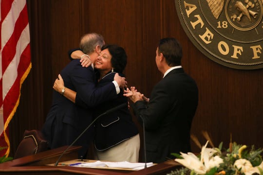 Sen. Wilton Simpson hugs Sen. Kathleen Passidomo during a meeting of the 2019 Republican Caucus where Simpson, R-Citrus, was nominated as Senate president-designate for the 2020-2022 sessions Tuesday, Oct. 15, 2019.  