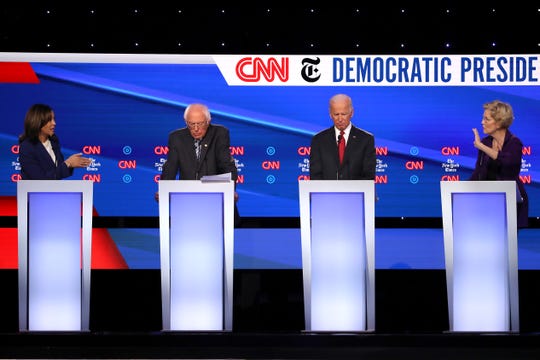 Sen. Kamala Harris speaks as Sen. Bernie Sanders, former Vice President Joe Biden, and Sen. Elizabeth Warren look on during the Democratic Presidential Debate at Otterbein University on October 15, 2019 in Westerville, Ohio.