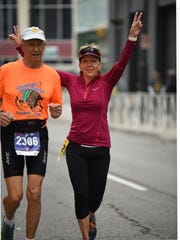 Bob Ranta, 87, of South Lyon, with his niece, Sandy Logan, 57, of Northville, run in the Detroit Free Press Marathon on Sunday, Oct. 20, 2019.