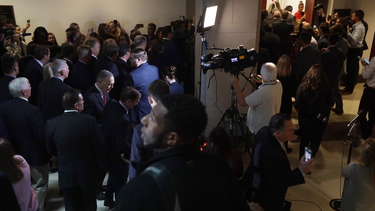 About two dozen House Republicans enter a secure room, called a sensitive compartmented information facility (SCIF), where the House Intelligence, Foreign Affairs and Oversight committees have taken private depositions in the impeachment inquiry at the U.S. Capitol on Oct. 23, 2019 in Washington, D.C.