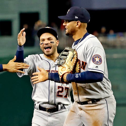 Astros infielders celebrate after Yuli Gurriel mad