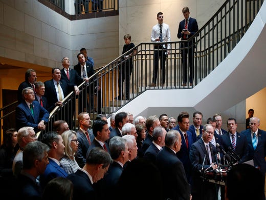 House Republicans gather for a news conference after Deputy Assistant Secretary of Defense Laura Cooper arrived for a closed door meeting to testify as part of the House impeachment inquiry into President Trump, Oct. 23, 2019, on Capitol Hill in Washington.