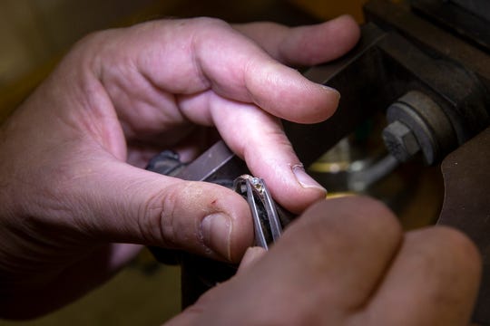 Joel McFadden, owner of The Art of Jewelry, a Red Bank-based business that designs and sells jewelry, works on a ring at his business in Red Bank, NJ Tuesday, November 5, 2019. 