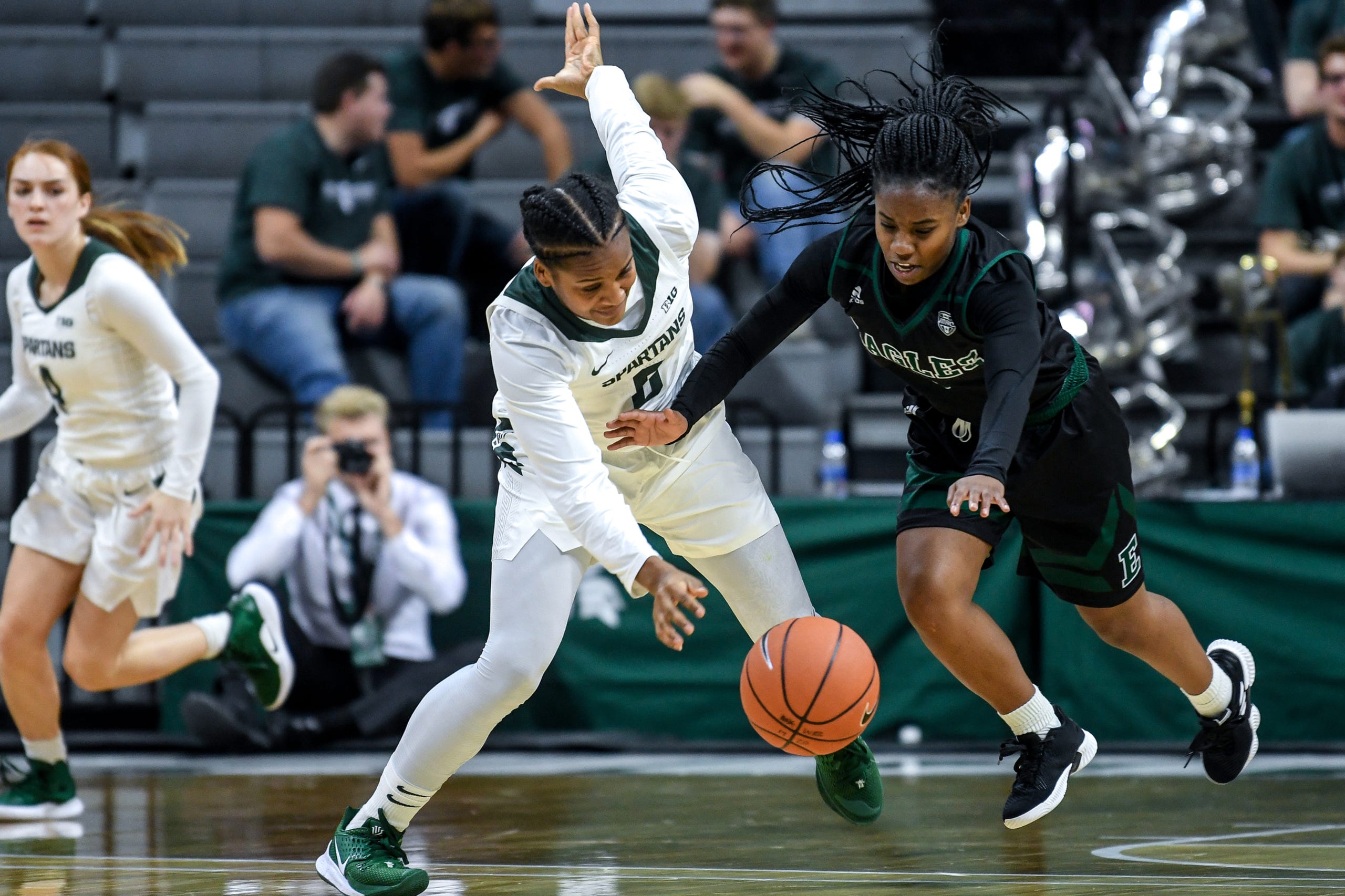 Michigan State's Shay Colley, left, is fouled by Eastern Michigan's Aaliyah Stanley during the fourth quarter on Tuesday, Nov. 5, 2019, at the Breslin Center in East Lansing.